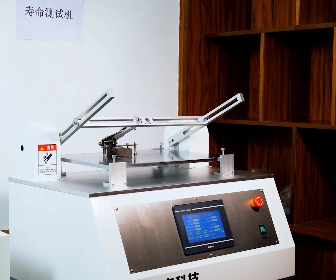 HSP cycle-life testing machine with a hinge fixture mounted on the test table