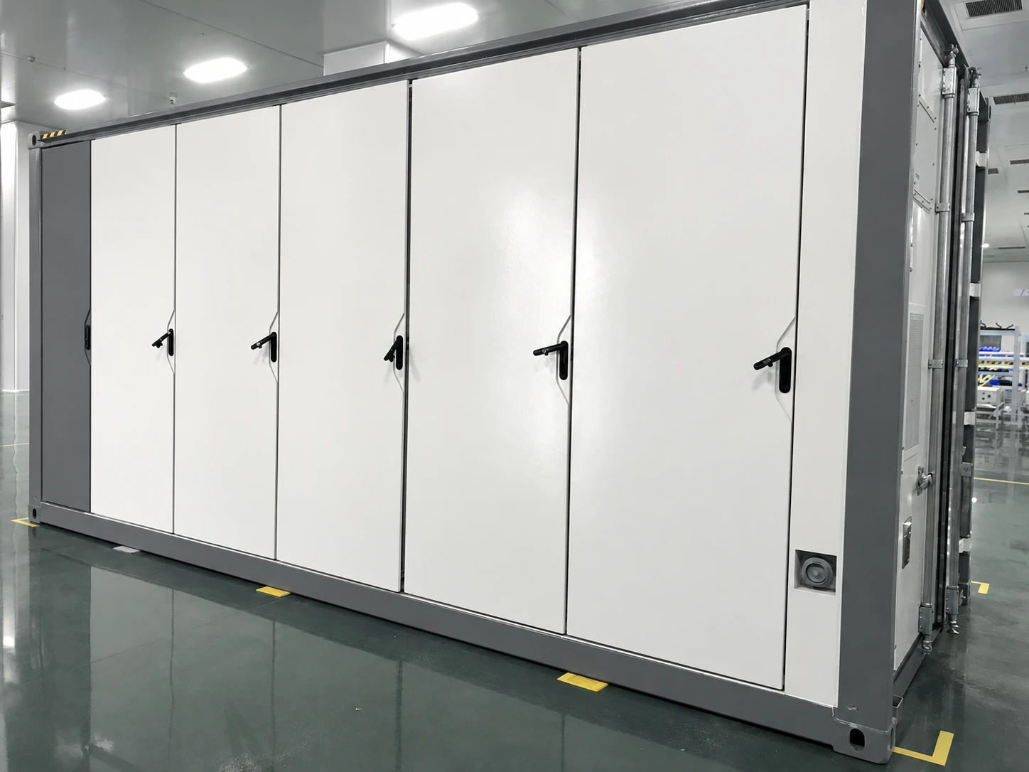 Full-height BESS enclosure doors in assembly area